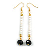 Long White/Black Bead Linear Earrings In Gold Tone - 70mm L