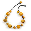 Yellow Wood Bead Black Cotton Cord Necklace - 52cm Long
