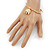 Gold Tone Slip-On Cuff Bracelet With A White Enamel Elephant Charm - 19cm L - view 2