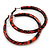 Medium Orange/ Black Snake Print Hoop Earrings In Silver Tone - 55mm Diameter - view 3
