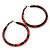 Medium Orange/ Black Snake Print Hoop Earrings In Silver Tone - 55mm Diameter - view 4