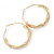 60mm Large Twisted Spring Hoop Earrings In Gold Tone Metal - view 2