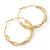 60mm Large Twisted Spring Hoop Earrings In Gold Tone Metal