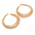 40mm Coil Spring Hoop Earrings In Gold Tone - Medium - view 7