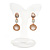 Striking Milky White/ Champagne Crystal Drop Clip On Earrings In Rose Gold Tone Metal - 35mm L - view 5