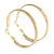 50mm Wide Polished Hoop Earrings In Gold Tone