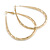 Large Thick Etched Oval Hoop Earrings In Gold Tone - 70mm L - view 4