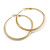 60mm Large Textured Thick Hoop Earrings In Gold Tone Metal - view 9