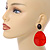 Statement Black/ Red Acrylic Curvy Oval Drop Earrings In Gold Tone - 75mm L - view 3