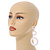 Long Triple Hoop White Acrylic Drop Earrings with Gold Tone Post Closure - 95mm L - view 2