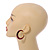 Trendy Magenta/ Black Floral Print Acrylic Hoop Earrings In Gold Tone - 43mm Diameter - Medium - view 2