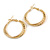 30mm Medium Textured Twisted Hoop Earrings In Gold Tone - view 4