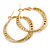 30mm Medium Textured Twisted Hoop Earrings In Gold Tone - view 5