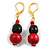 Black Glass and Red Wood Beaded Drop Earrings in Gold Tone - 50mm Drop - view 2