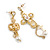 Cupid and Cross Dangle Assymetrical Earrings in Bright Gold Tone - 90mm Long - view 2