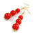 Graduated Red Acrylic Bead Drop Earrings in Gold Tone - 60mm Long