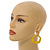 Off Round Textured Curvy Hoop Earrings in Gold Tone (Yellow Matt Finish) - 50mm Long - view 3