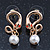 Sleek Simulated Pearl 'Snake With Red Eyes' Stud Earrings In Gold Plating - 30mm Length